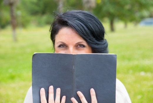 Woman covering her smile