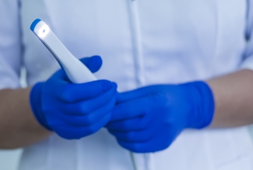 Dentist holding an intraoral camera