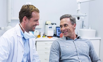 a person smiling during a dental consultation