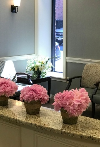 Flowers on desk of Lowell dental office waiting room