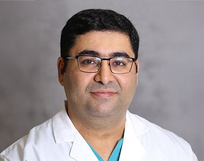 smiling Dr. Abulfaz Isayev, DMD, PhD
