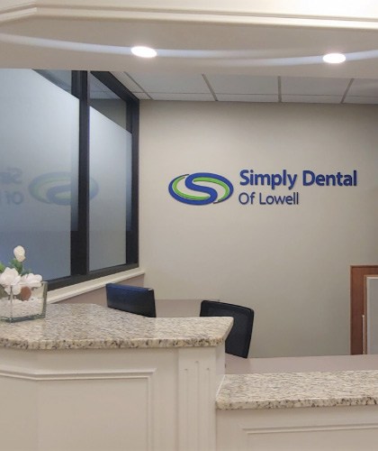 photo of dentist with patient